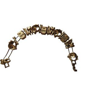 VTG Metal Dentist themed sliding charm gold tone bracelet tooth floss paste 8"